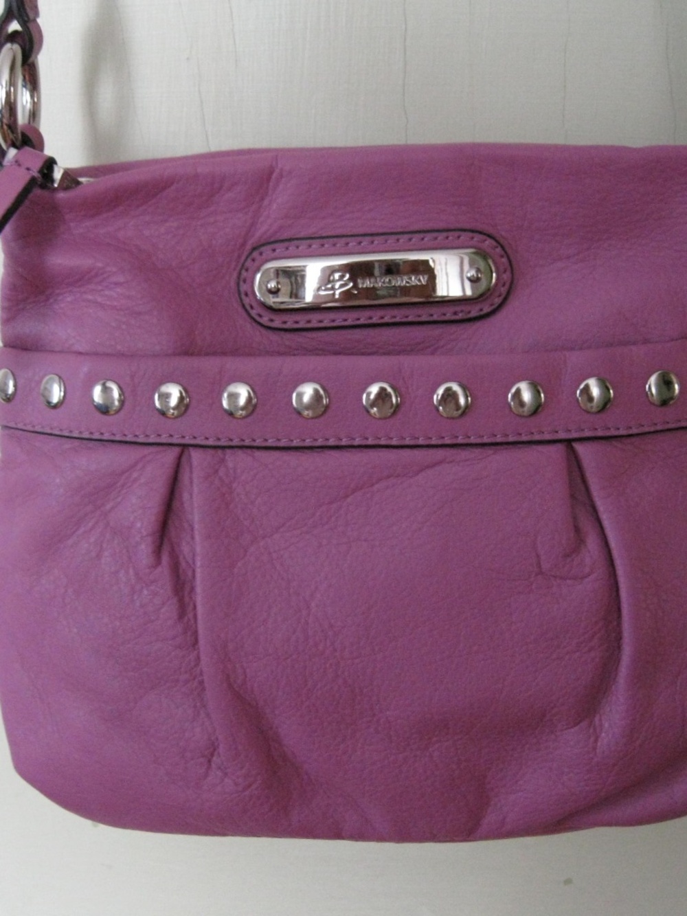 B. Makowsky purple leather crossbody handbag